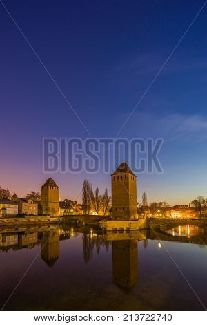 medieval bridge Ponts Couverts and barrage Vauban, night scene of Strasbourg, France