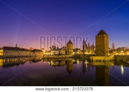 medieval bridge Ponts Couverts and barrage Vauban, night scene of Strasbourg, France
