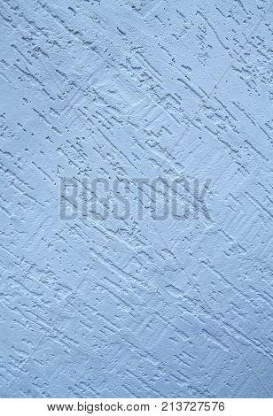 the background is made of a texture of Venetian plaster of blue color. Style bark beetle with a relief surface