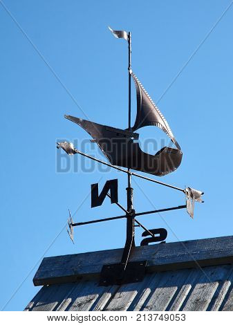 Weathervane show the wind direction on blue sky background