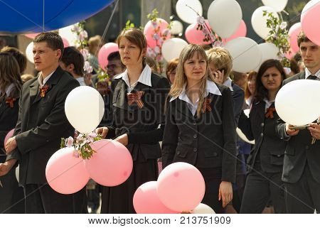 Tyumen, Russia - September 1, 2012: School 43. School line is in schoolyard with pupils and teachers. Feast Day of Knowledge.