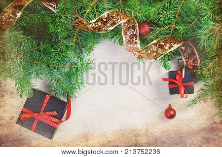 Black And Red  Christmas  Gift  Box With Red Ribbon And Fir Branches