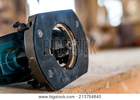 Closeup woodeworking rooter lying on table in joinery