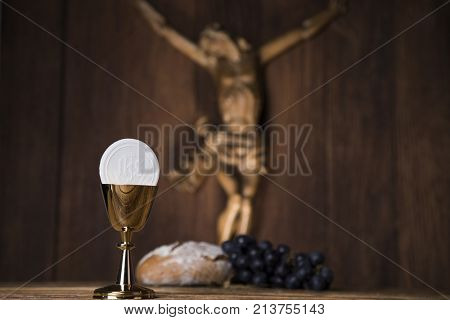 Eucharist symbol of bread and wine, chalice and host, First communion background