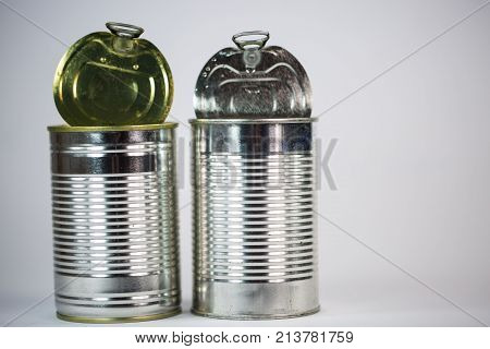 Tin cans on white background, space, nobody,