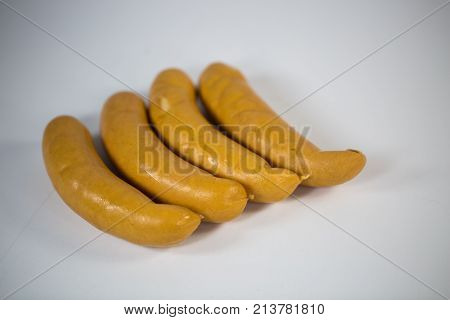 Curry sausages raw lying white background, curry sauges