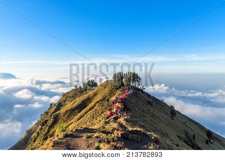 Camping site on crater rim of Mount Rinjani at sunset. Lombok Island Indonesia.