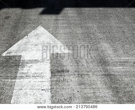 Arrow road sign point to the shadow.