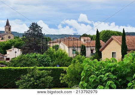 Beautiful view on the medieval village of Mazan after sammer rain Provence France
