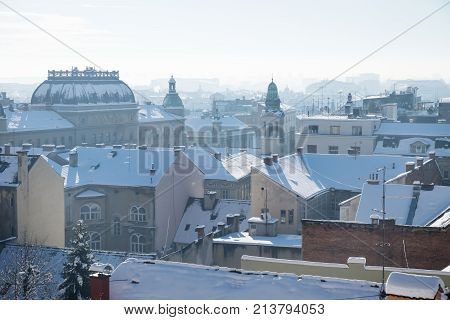 Panorama view over Zagreb with historic towers and buildings during winter with snow over the roofs during sunny weather, Zagreb, Croatia, Europe