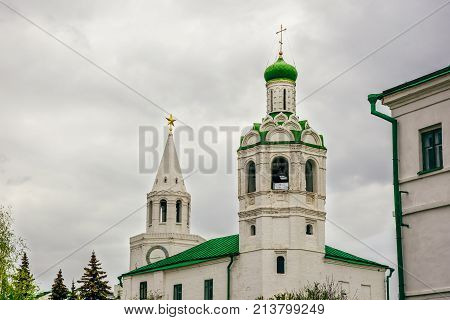 Church of St. John the Baptist Monastery and Savior Tower on Background at Overcast Weather.