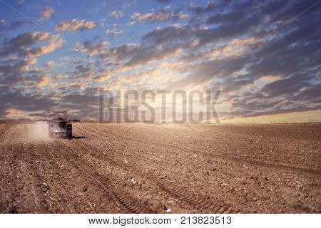 agriculture arable land field with tractor machine working