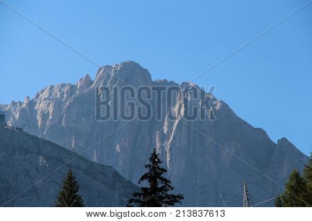 The view of mountain massif and blue sky in a sunny day.