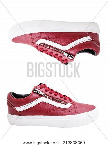 Fashion shoes with shoestring. Red sneaker and shoelace isolated on white background