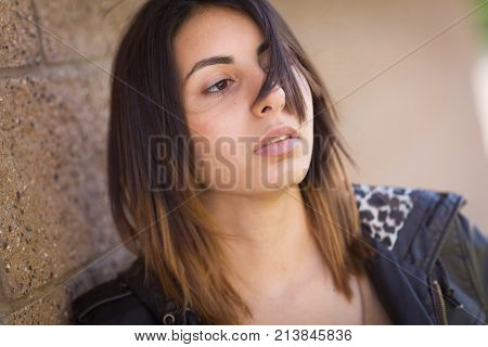 Beautiful Meloncholy Mixed Race Young Woman Portrait Outside.