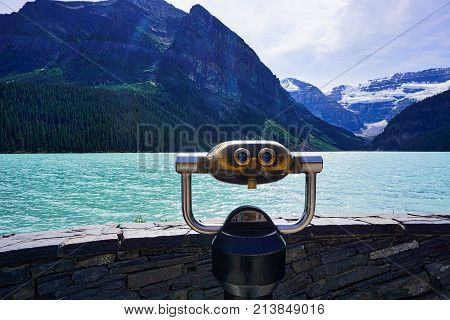Coin-operated binoculars with Lake Louise in background