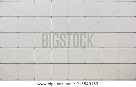 Gray tiles wall texture. Tiled wall background.
