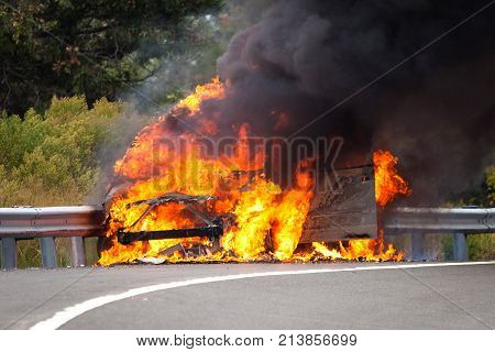 Car On Fire With Passengers