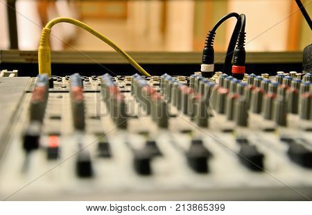 Close up of cables on mix pult. Music and sound theme.