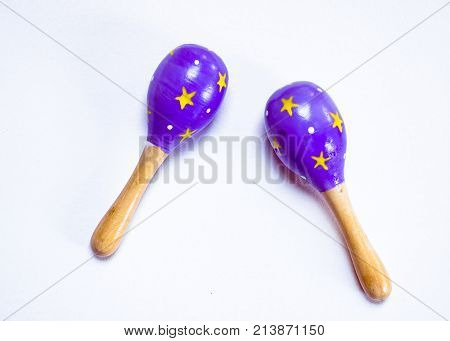 Maracas on the white background. Maracas or Rumba shaker is a percussion instrument usually played in pairs, one in each hand by holding.