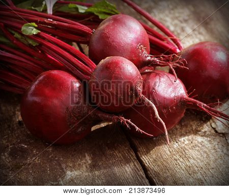 Fresh beetroot on rustic wooden background. Harvest vegetable cooking conception . Diet or vegetarian food concept .