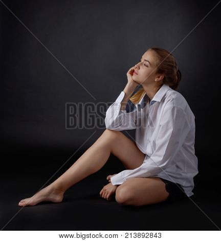 Young Pretty Woman In White Shirt