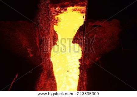 Cast iron and metal at the metallurgical plant. Molten metal in the furnace