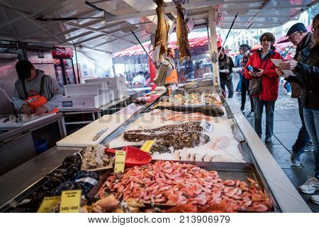 BERGEN, NORWAY - JUNE 16,2017: The Bergen Fish Market (Fisketorget) with itÃ¢??s abundance of fish and other seafood. A very popular object for tourists.