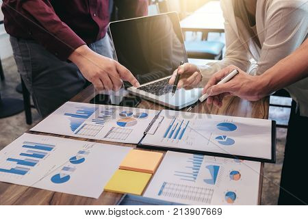 Startup business people group meeting Young creative coworkers team working and discussing new plan project in office entrepreneurs brainstorming Teamwork analyze plans professional investor.