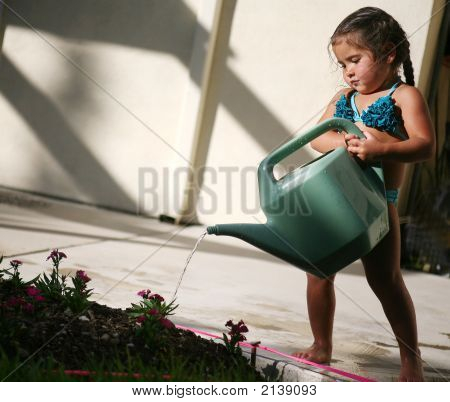 Child Watering Flowers