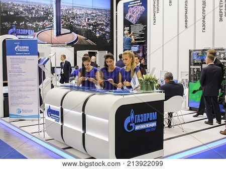 St. Petersburg, Russia - 3 October, Girls standistas behind the counter, 3 October, 2017.
Participants and visitors of the annual St. Petersburg Gas Forum.