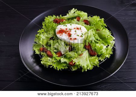 Traditional French Salad Lyonnaise On Plate