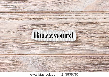 Buzzword of the word on paper. concept. Words of Buzzword on a wooden background.