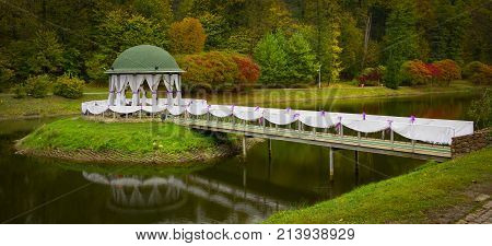 Gazebo in the park surrounded by fall foliage at autumn, Feofania