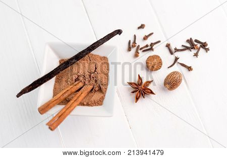 cinnamon, nutmeg and vanilla on a white background isolated
