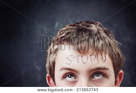 Student with stupid written on his forehead