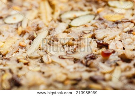 Food textures and patterns concept. Detailed closeup of whole grain bread with many big grains