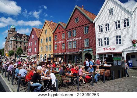 People Sit In Street Cafe In Bergen, Norway