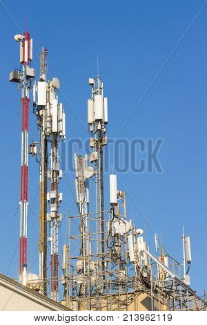 Three mobile phone communication tower transmission signal.