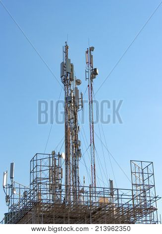 Three mobile phone communication tower transmission signal.
