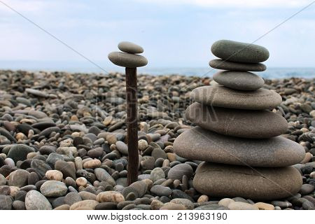 Turret from a large sea pebbles close-up on the beach.