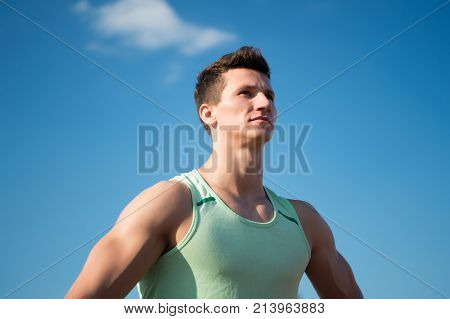 Athlete In Green Tshirt On Sunny Day