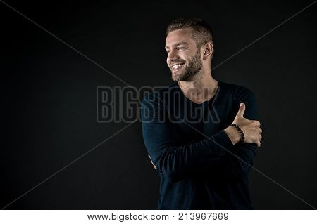Man With Happy Unshaven Face In Studio.