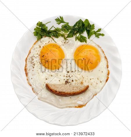 Eggs parsley (vegetables/bread/ketchup) is formed by a funny face on a white plate. The concept of food for children