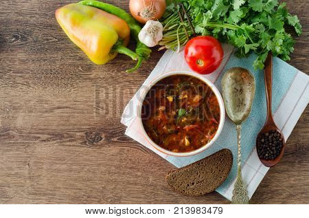 Bowl of traditional soup Borscht on table