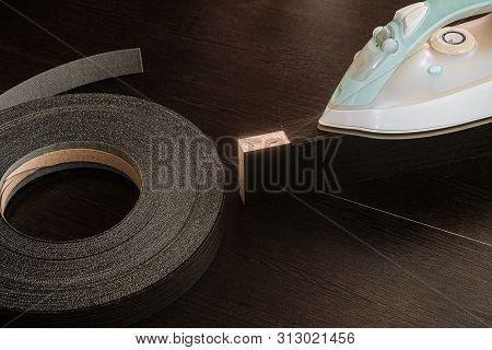 Roll Melamine Edge For Finishing Of Furniture And Hot Smoothing-iron Used For Gluing Edges. Edging T