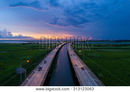 Aerial View Of Mobile Bay And Interstate 10 Bridge At Sunset From Daphne, Alabama.