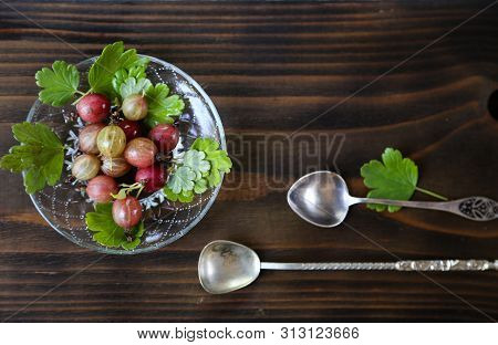 Sweet Fresh Gooseberry Berry In A Bowl On Dark Background.