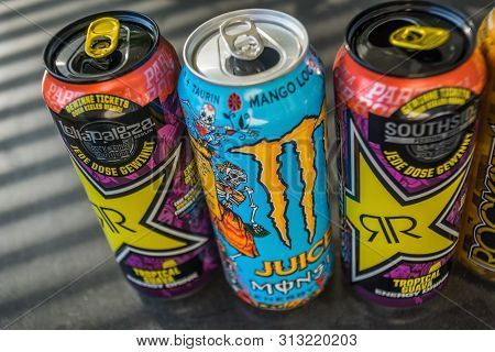 Boeblingen,germany - July 24,2019:stettiner Strasse Three Colorful Cans Of Energy Drinks Were Standi