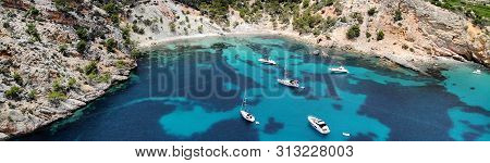 Drone Panoramic View Directly From Above Moored Yachts In The  Cala Blanca Andratx In The Palma De M